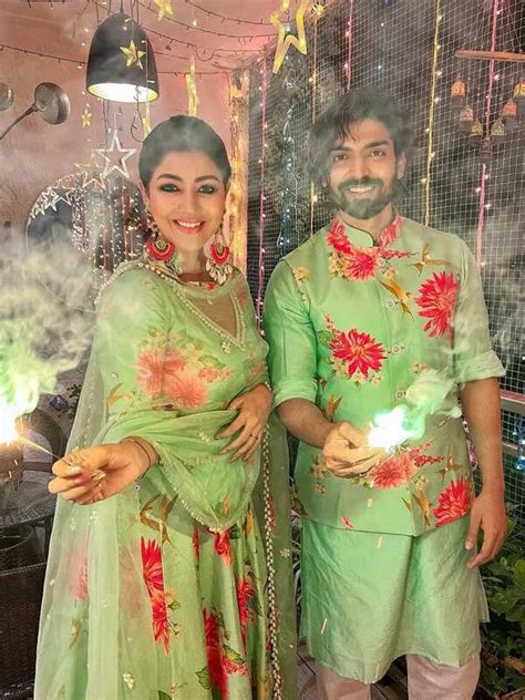 Pregnant Debina Bonnerjee flaunts baby bump in tube top, stockings and ...