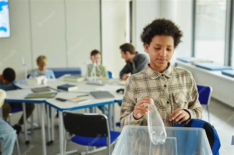 Premium Photo | Waist up portrait of young black girl using waste ...