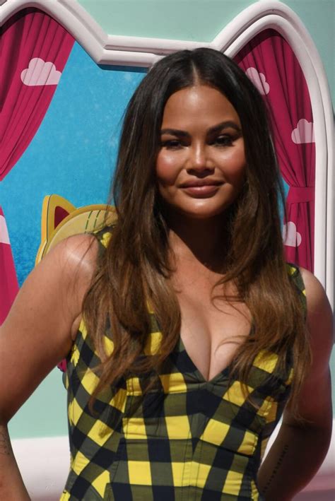 Chrissy Teigen Champions Autumnal Textures At Movie Premiere • CelebMafia