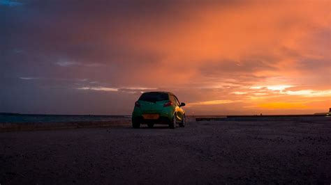 Download wallpaper 1366x768 mazda, car, sunset, sky, clouds tablet ...