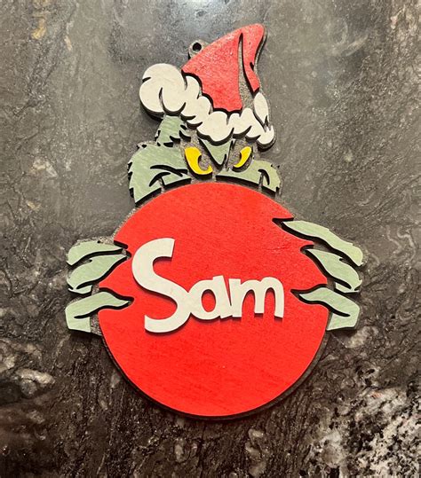 Grinch Holding an Ornament - Etsy