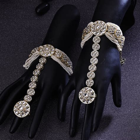 Sukkhi Elegant White Rhodium Plated Kundan & Pearl Ethnic Haathphool F ...