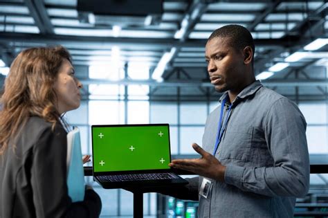 Employees using isolated screen notebook to configure server cluster ...