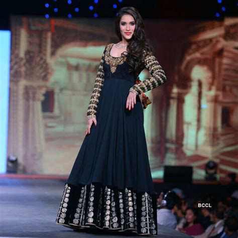 A model walks the ramp during the Caring with Style fashion show ...