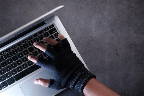 Cyber crime concept hacker hand stealing data | Premium Photo