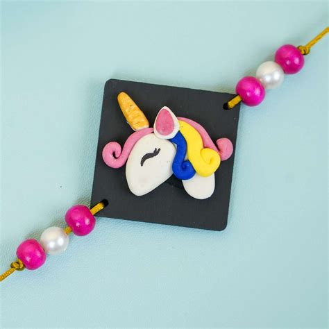 Buy Handmade Miniature Clay Unicorn Kids Rakhi With Roli Chawal Online ...