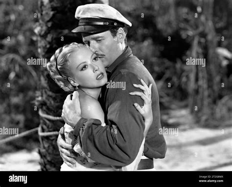 Adele Mara, Gig Young, on-set of the film, "Wake of the Red Witch", Republic Pictures, 1948 ...
