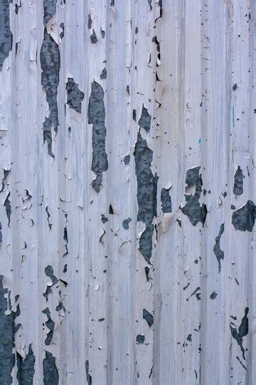 Texture corrugated metal surface with old white paint the paint peeled ...