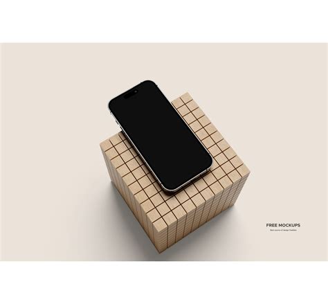 Top View Titanium iPhone 16 Pro Lying On Wooden Cube Free