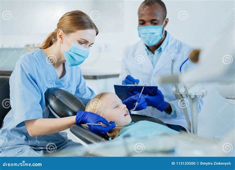 Medical Student Practicing Under Supervision of Experienced Dentist ...