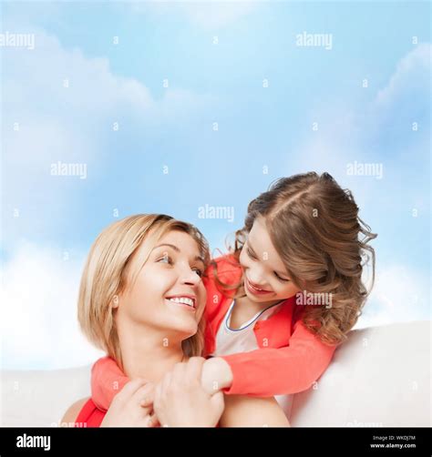 hugging mother and daughter Stock Photo - Alamy