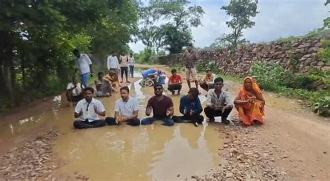 WATCH: Villagers Sit In Muddy-Potholes to Protest Poor Roads In Madhya ...