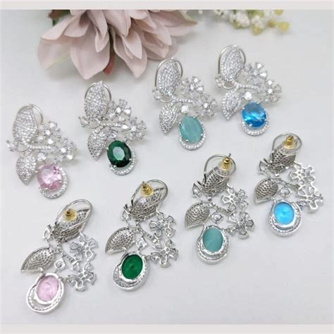 Kavita Art Silver Plated American Diamond Dangler Earrings (Assorted C ...