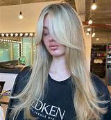 Best 10 Layered Haircuts with Curtain Bangs - Taper Haircuts