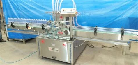 Filling Machine - Automatic Four Head Filling Machine Manufacturer from ...