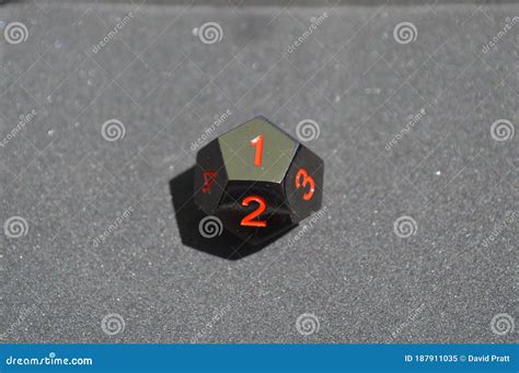 Black Metallic D12 Twelve Sided Dice on Foam Surface Stock Image ...