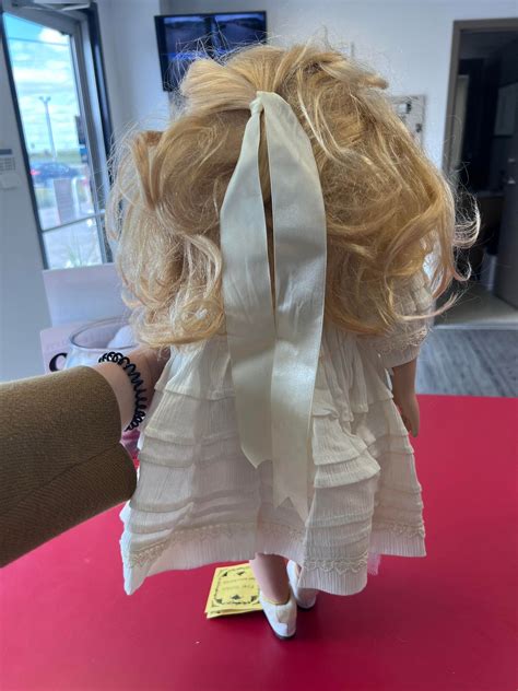 Hand-painted First Golden Doll porcelain doll | Total Storage Winnipeg