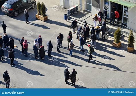 People stand in lines at an Upper East Side grocery store in New York.