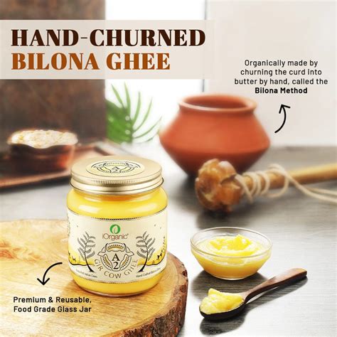 A2 Certified iOrganic Gir Cow Ghee jar beside a spoonful of ghee ...
