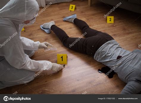 Criminalist collecting crime scene evidence — Stock Photo © Syda ...