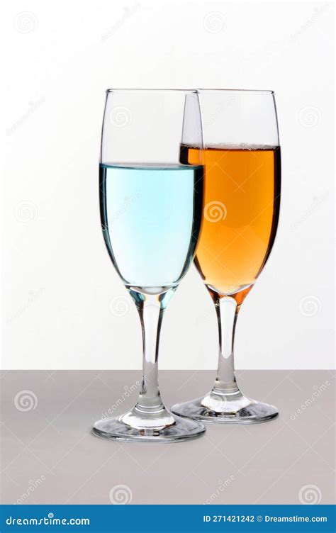 Orange and Blue Colored Cocktail Drinks in Glass Goblets Stock Photo ...