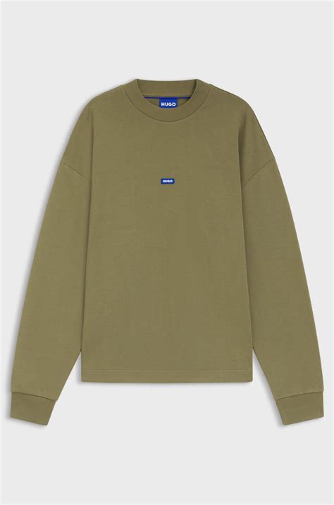HUGO - Cotton-terry sweatshirt with blue logo patch - Olive