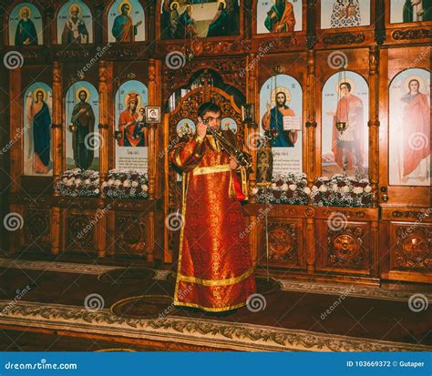 A Young Deacon Censes the Censer before the Altar at the Divine Liturgy ...