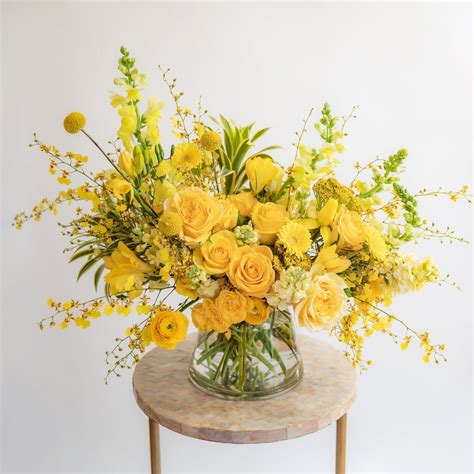 Monochromatic Yellow Arrangement | Yellow flower arrangements, Yellow ...