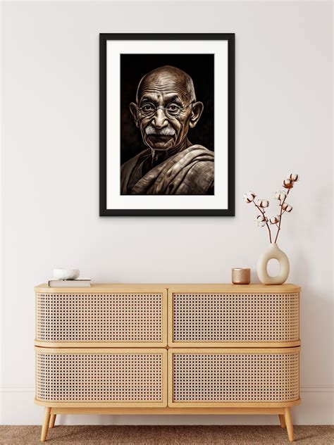 A Stunning Charcoal Portrait Print of Mahatma Gandhi Against a Bold Bl