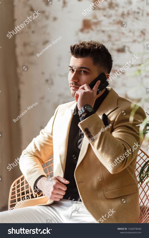 Suit Man Sitting 的图像结果