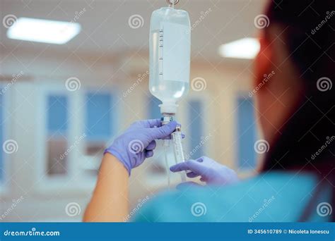 Nurse Preparing Iv Bag Injecting Medication in a Hospital Stock Image ...