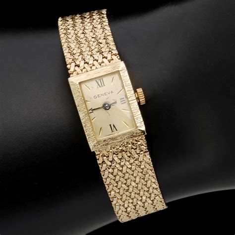 #324: A GENEVA LADIES 14 KARAT GOLD WATCH AND BAND