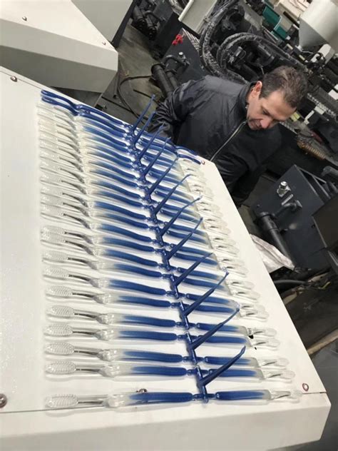 Image result for Toothbrush Molding Machine