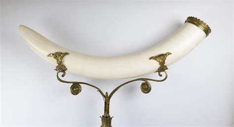 Lot - Ivory elephant tooth on bronze stand