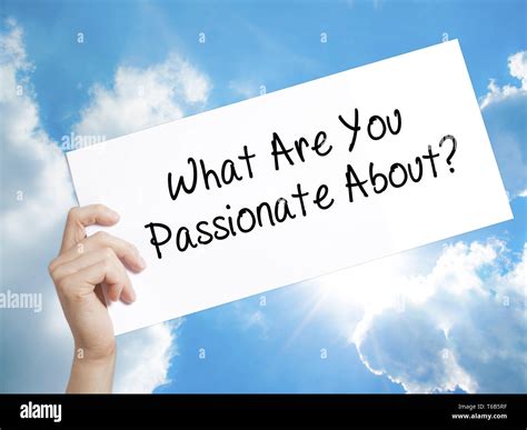 What Are You Passionate About? Sign on white paper. Man Hand Holding Paper with text. Isolated ...