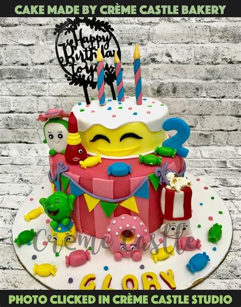 A Multicolor tier cake in Candy land theme with so many candies in ...