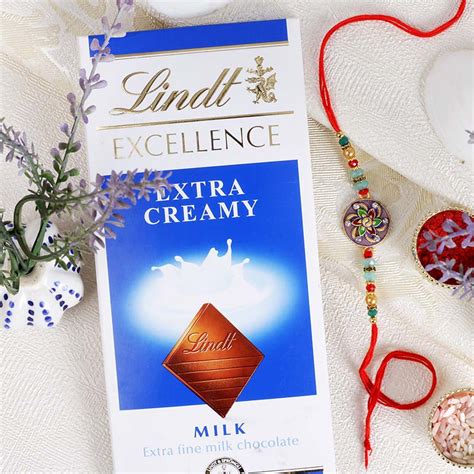 Send Fancy Dial Shape Rakhi with Lindt to Switzerland Online