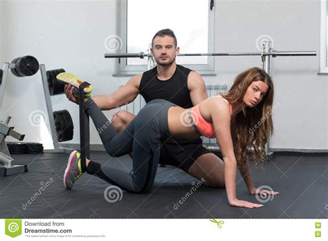 Gym Coach Helping Woman With Resistance Bands Stock Photo - Image of action, activity: 72719380