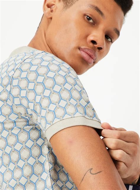 Buy Men Slim Fit Printed Polo T-shirt Online at just Rs. 699.0 ...