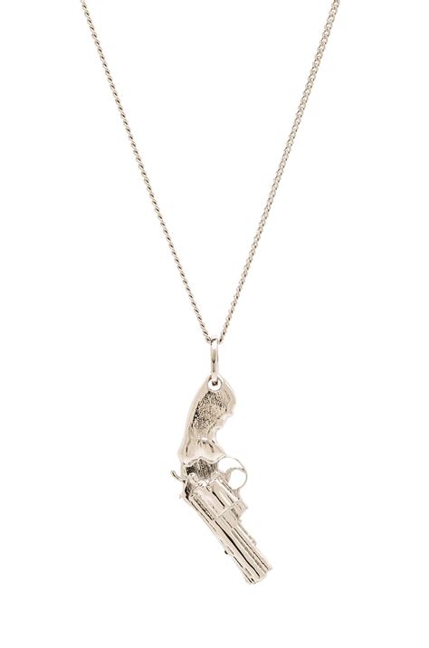 Saint Laurent Gun Pendant Necklace in Silver | FWRD