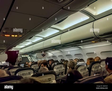 Airplane, inside, passengers Stock Photo - Alamy