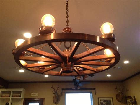 Wagon wheel chandelier with antique light bulbs | My Country Life ...