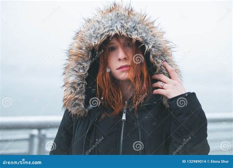 Redhead in Winter Jacket during a Snowstorm Stock Photo - Image of ...