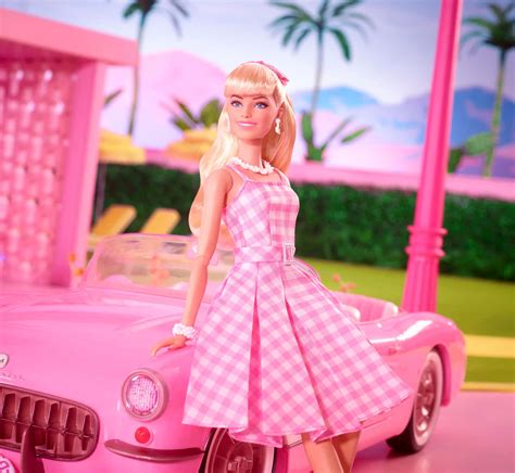 Download Pink Barbie Doll With Convertible Car Wallpaper | Wallpapers.com