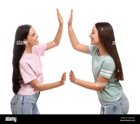 Women giving high five on white background Stock Photo - Alamy