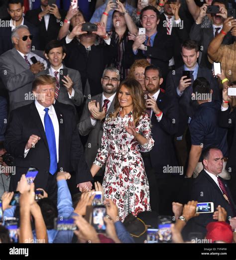 President Donald Trump and First Lady Melania Trump walk on stage ...