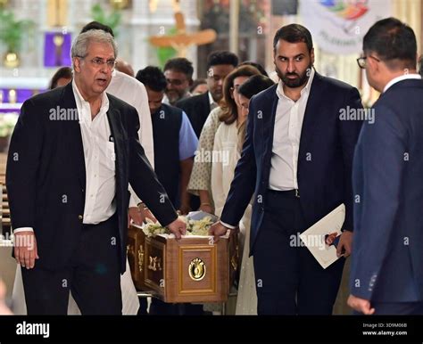 MUMBAI, INDIA - DECEMBER 6: Neol Tata, Neville Tata and family members carry the mortal remains ...