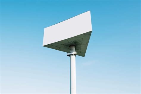 Triangle billboard on background of blue sky | Free Photo