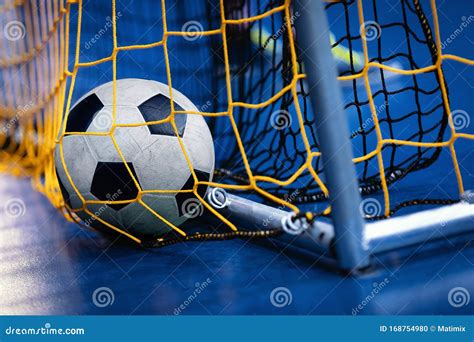 Indoor Soccer Futsal Ball On Goal With Net And Blue Background. Indoor ...