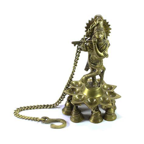 Brass Lord Krishna Playing Flute Wall Hanging with 9 Oil Wick Diya ...